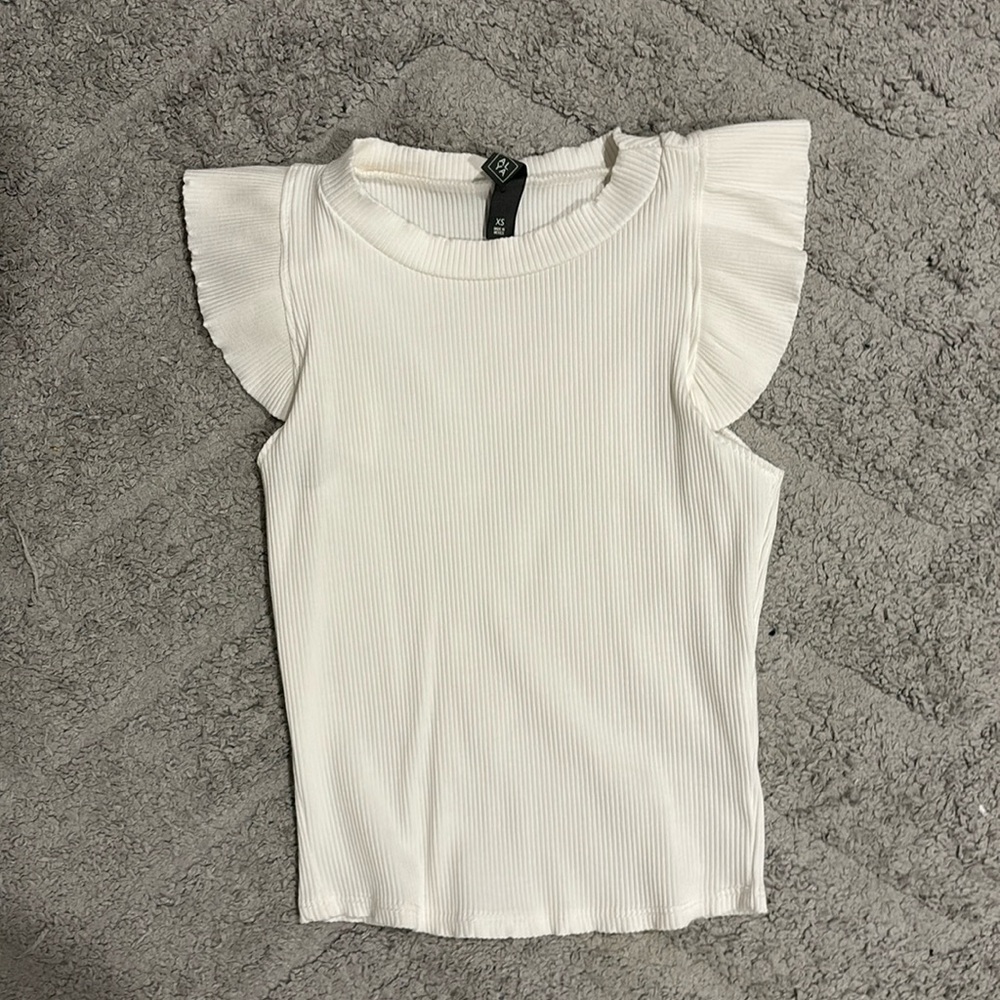 White Francesca’s ruffle sleeveless top